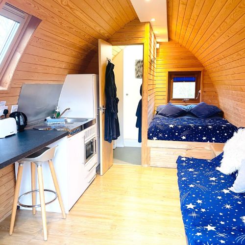 TreePod Bedroom, ensuite and kitchenette Inside The Treepod, Luxury Glamping, Warwickshire